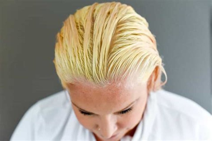How do I make my bleached hair less yellow?
