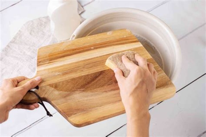 How do you clean a wooden kitchen table daily?