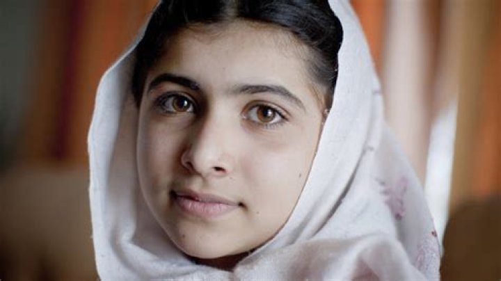 How long was Malala in a coma?
