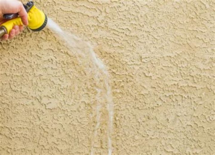 Is it safe to power wash stucco?