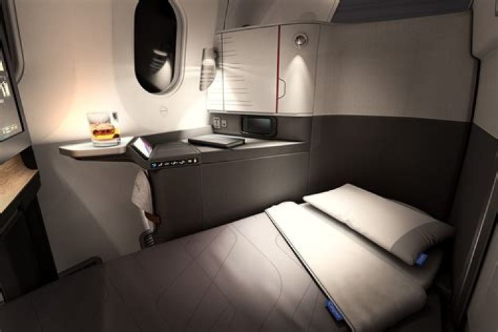 What airline has first class beds?