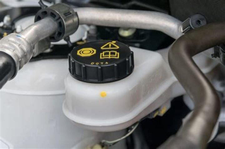 What are signs of low brake fluid?