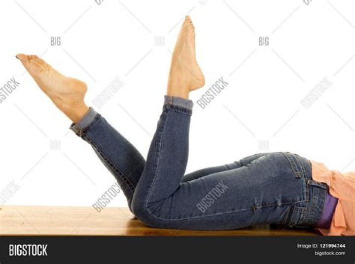 Why do girls lay on the floor with their legs up?